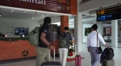Pasajeros en el Aeropuerto Internacional de Bali Foto Bisnis Bali